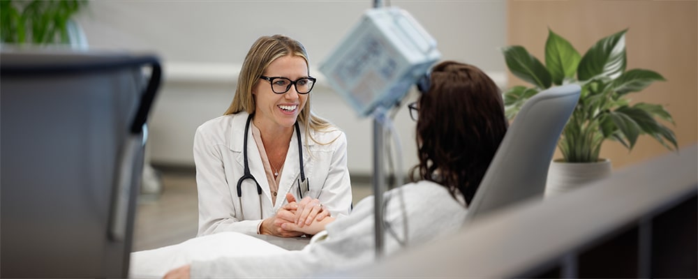 Physician supporting oncology patient